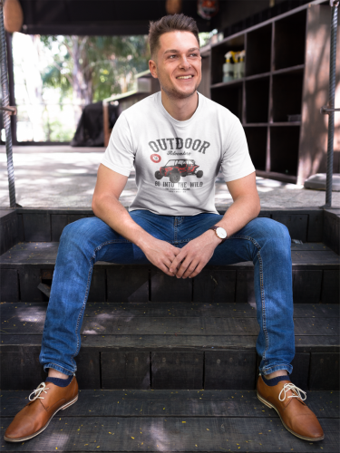 happy-guy-wearing-a-tshirt-template-while-sitting-on-steps-outdoors-a17850