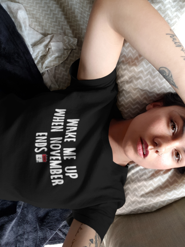 selfie-mockup-of-a-woman-wearing-a-round-neck-tee-on-her-bed-a17011