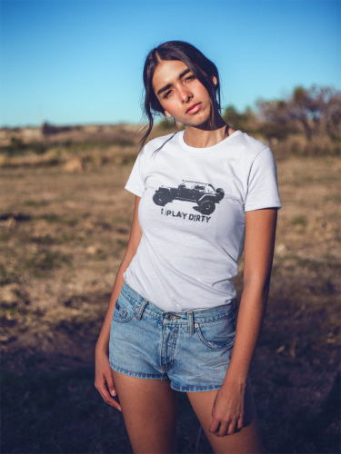 woman wearing tshirt with offroad vehicle graphic and denim shorts